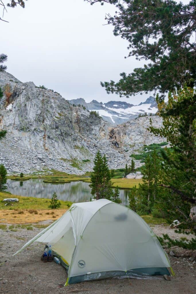 backpacking tent pitched with mountain in background