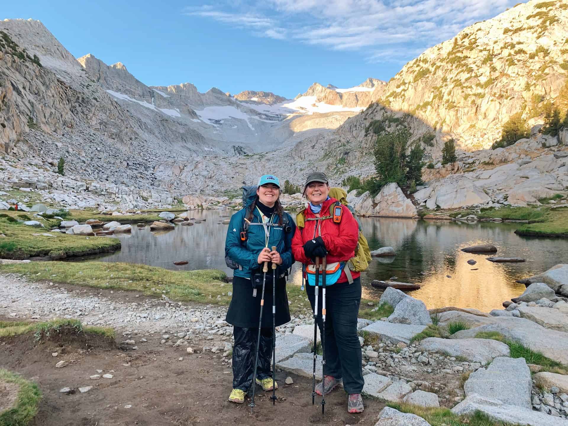 author Emily and her mom stand in front of Lyell Fork below Donohue Pass and mountain crest in Yosemite's high country