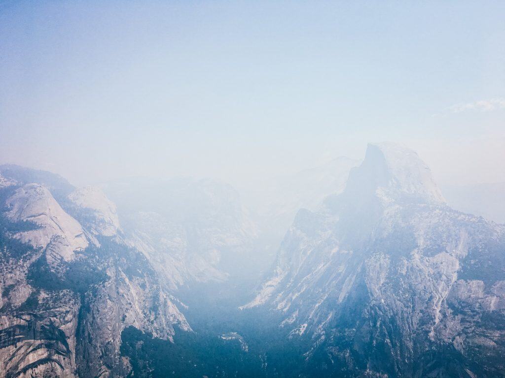 smoke obscures views of Half Dome at Glacier Point