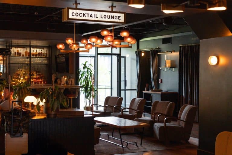 A cozy, retro seating area in front of the full bar at High Country Motor Lodge in Flagstaff, Arizona.